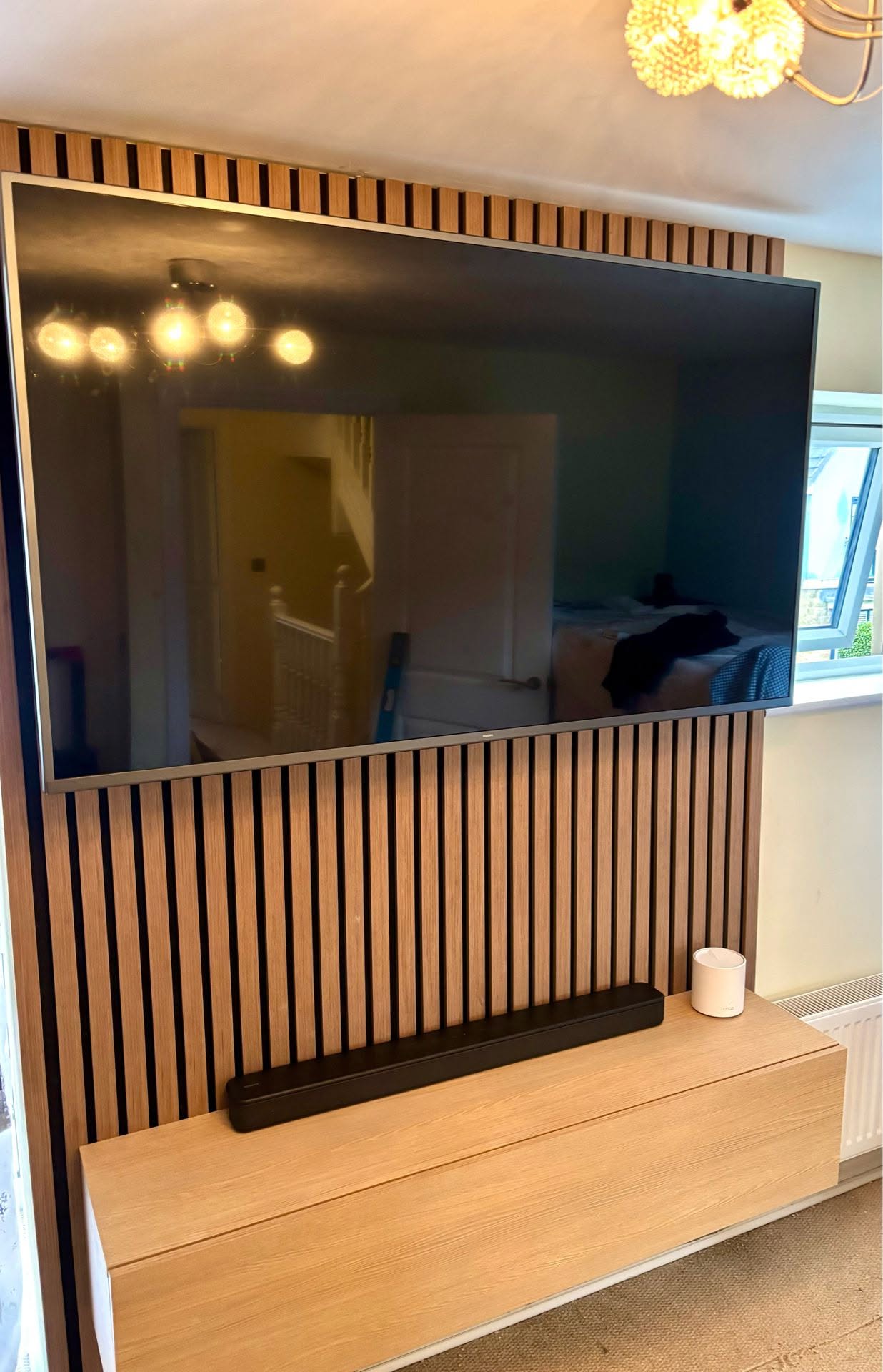 Bespoke media wall with integrated television and joinery